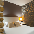 bedroom with stone wall